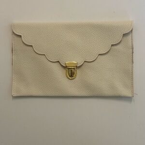 Elegant Cream Clutch with Gold Accent